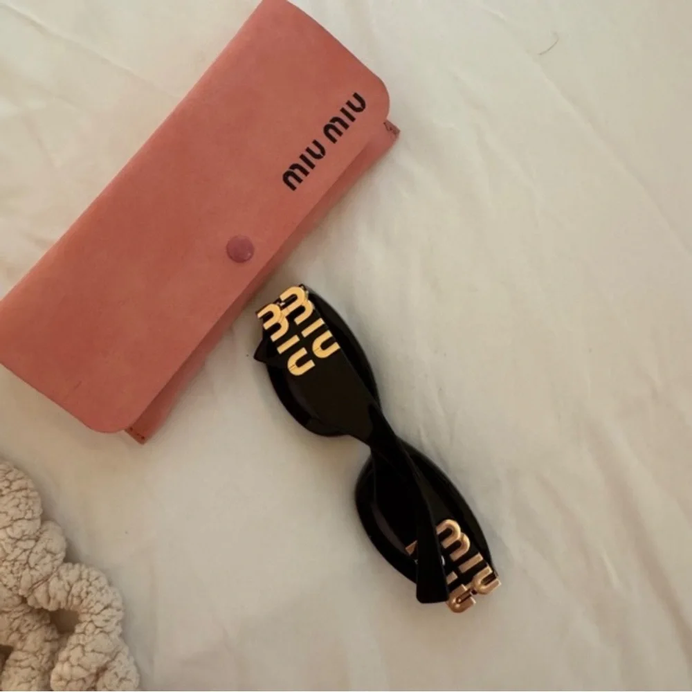 Miu Miu Glossy Black Cat-Eye Sunglasses with Pink Case